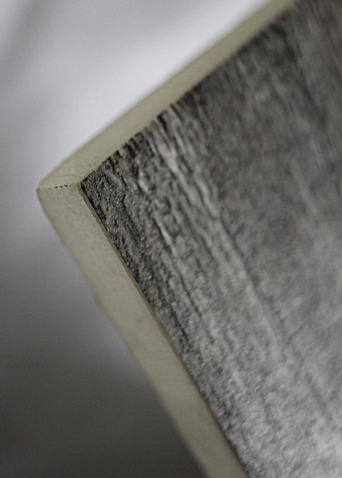 _porcelain_corner_tile The corner of a rectified, glazed porcelain tile